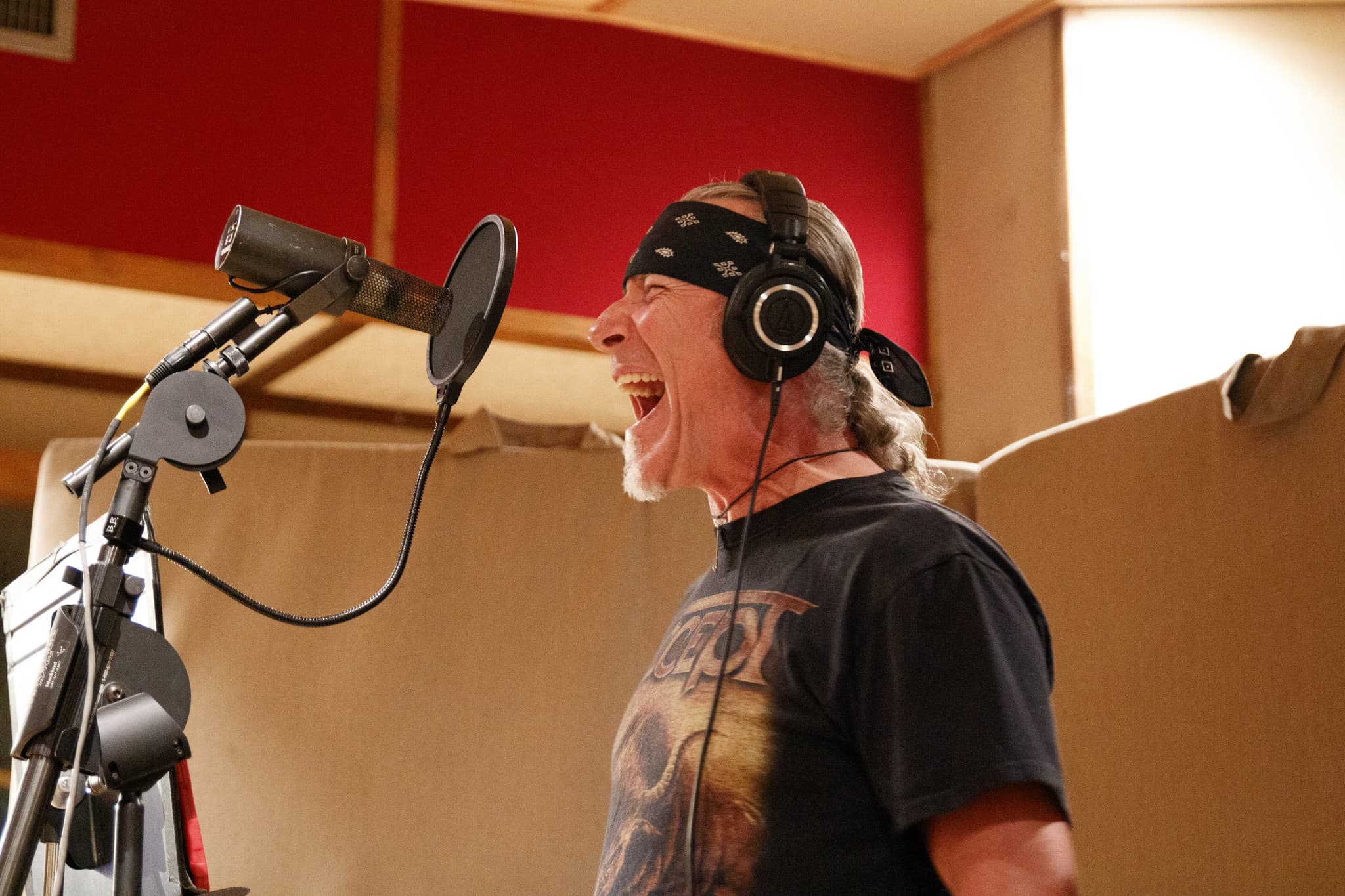 Charlie tracking vocals, singing into mic