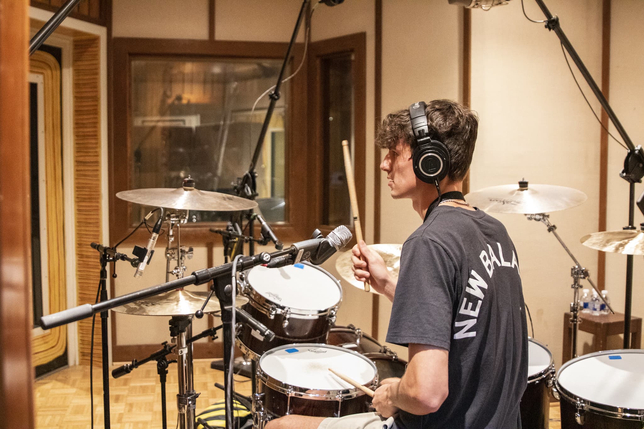 drummer in iso booth recording